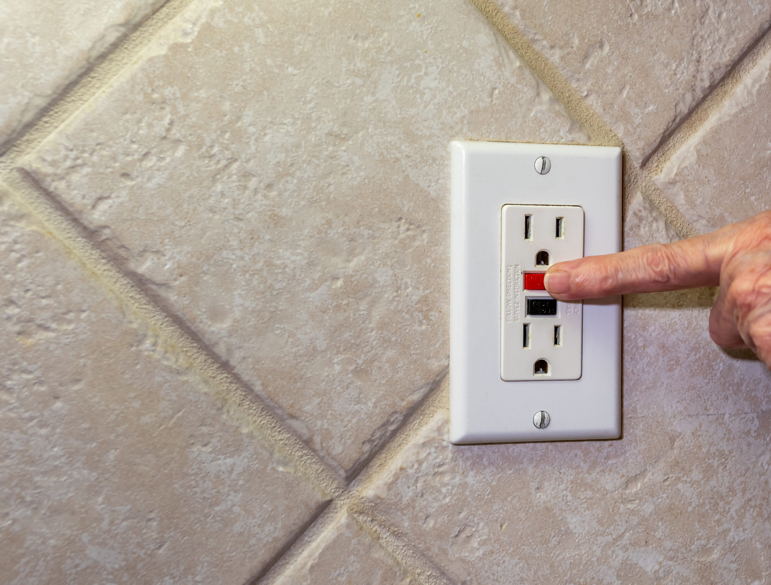 Outlets in the kitchen, bath, garage, basement, or other wet locations should be GFCI equipped