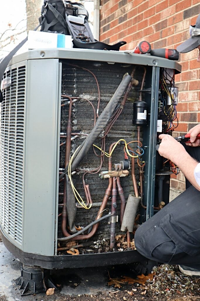 technician doing hvac repair service