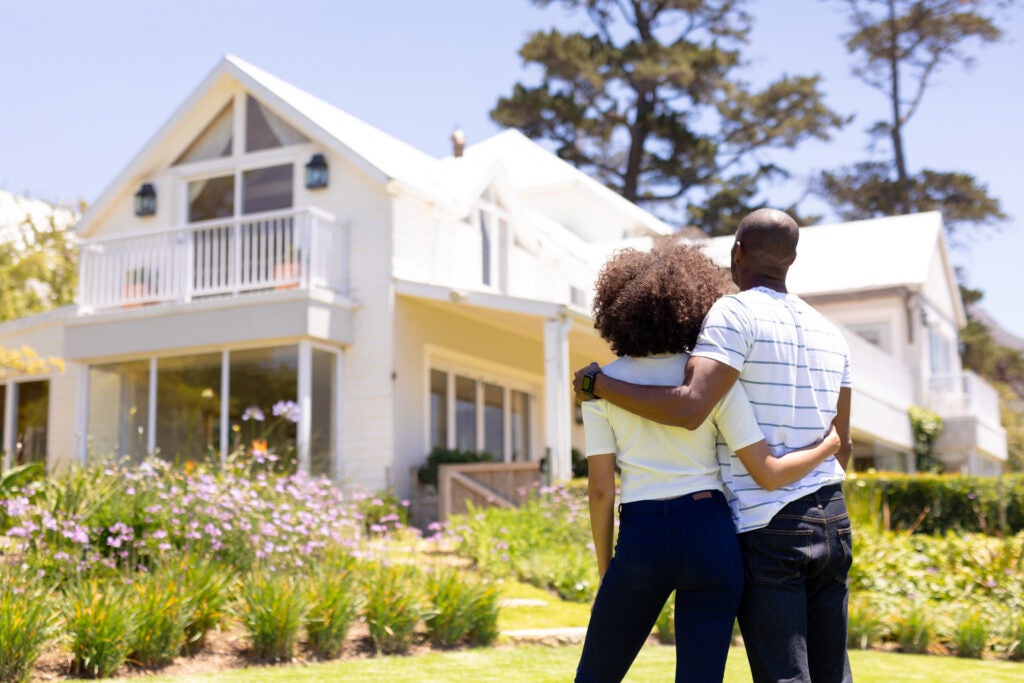 young couple looking at house